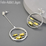 Boucles d'oreilles asymétriques en argent et or poissons | Felin-Addict